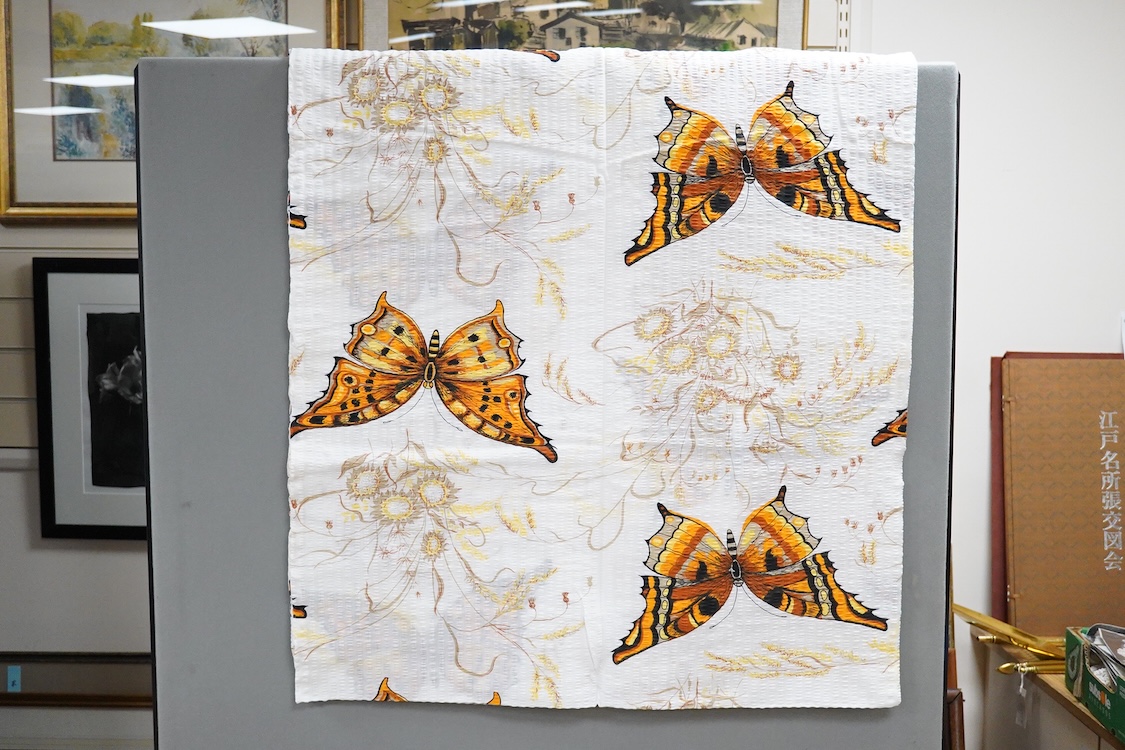A collection of late 20th century damask cloth napkins woven in bold pinks and blues, together with later butterfly seersucker printed panels